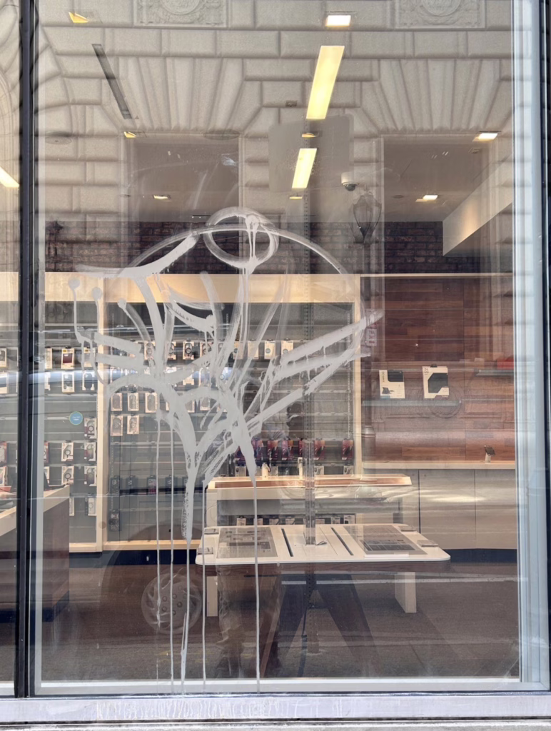 Storefront glass with Acid etch graffiti